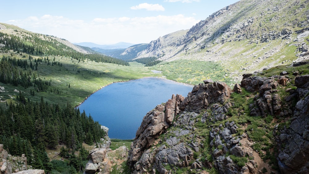 body of water near mountains