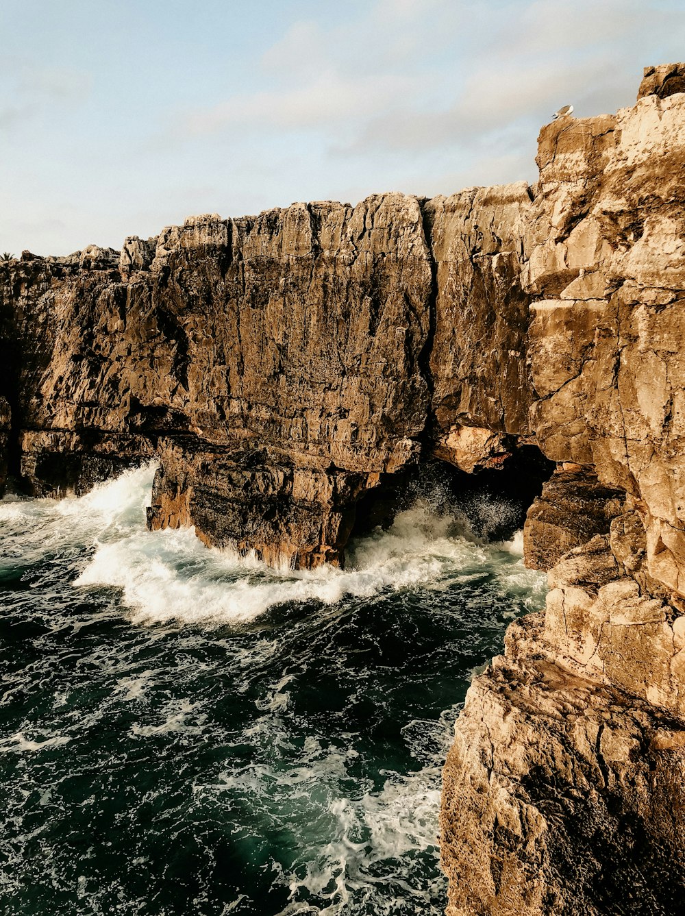 brown rocky hills viewing calm sea