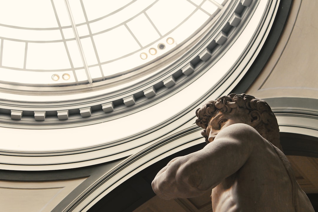 man themed statue inside dome building