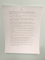 A piece of white paper is pinned to a light blue wall with a clear thumbtack. The paper contains a list of typed quotes, numbered from 1 to 13, each with a unique philosophical or motivational message.