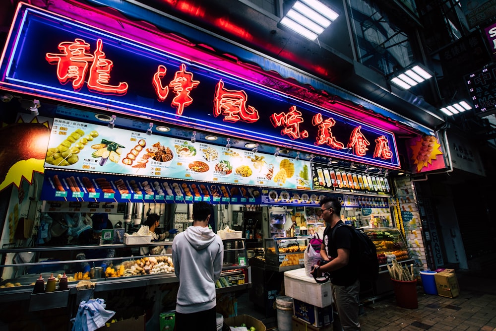 two men standing near store