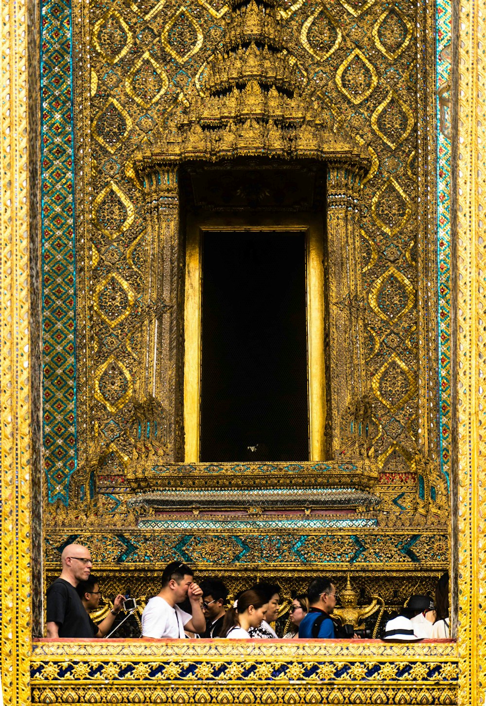 people in front of gold temple