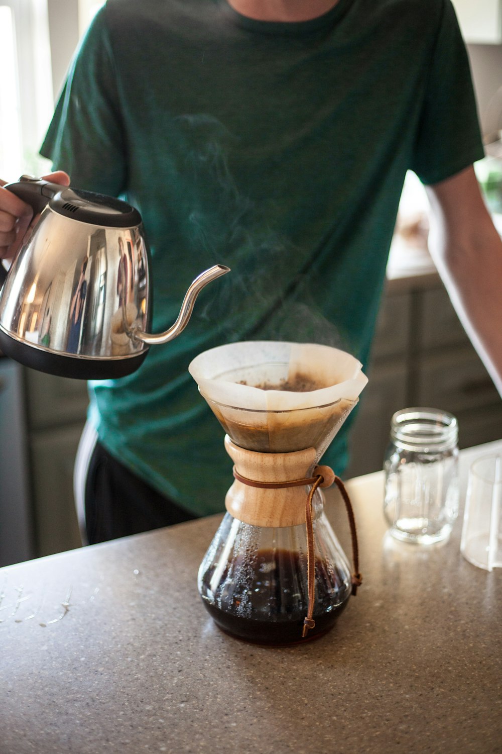 person pouring tea