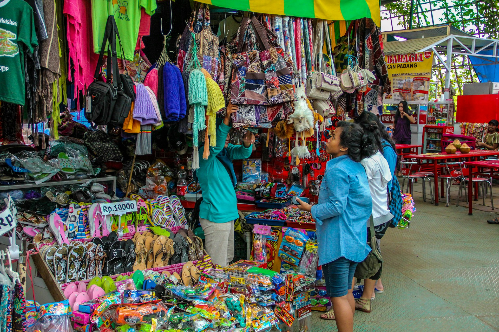 A vibrant market scene showcasing various trending products with price tags and discount signs.