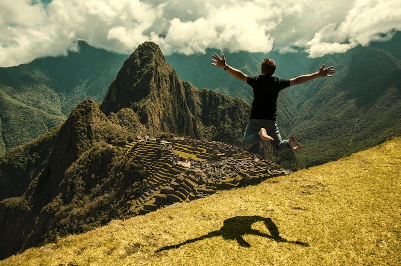 A lone traveller pausing at the Machu Picchu citadel