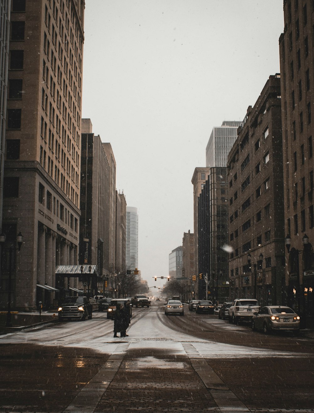 road with buildings under white sky