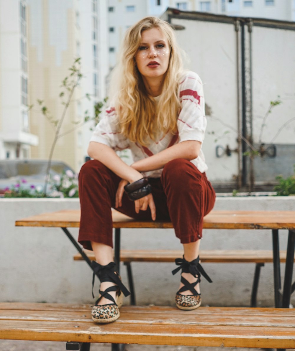 woman sitting on picnic bench