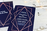 wedding invitation card on brown wooden surface