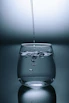 clear drinking glass on gray surface