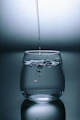 clear drinking glass on gray surface