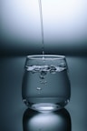 clear drinking glass on gray surface