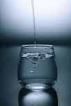 clear drinking glass on gray surface