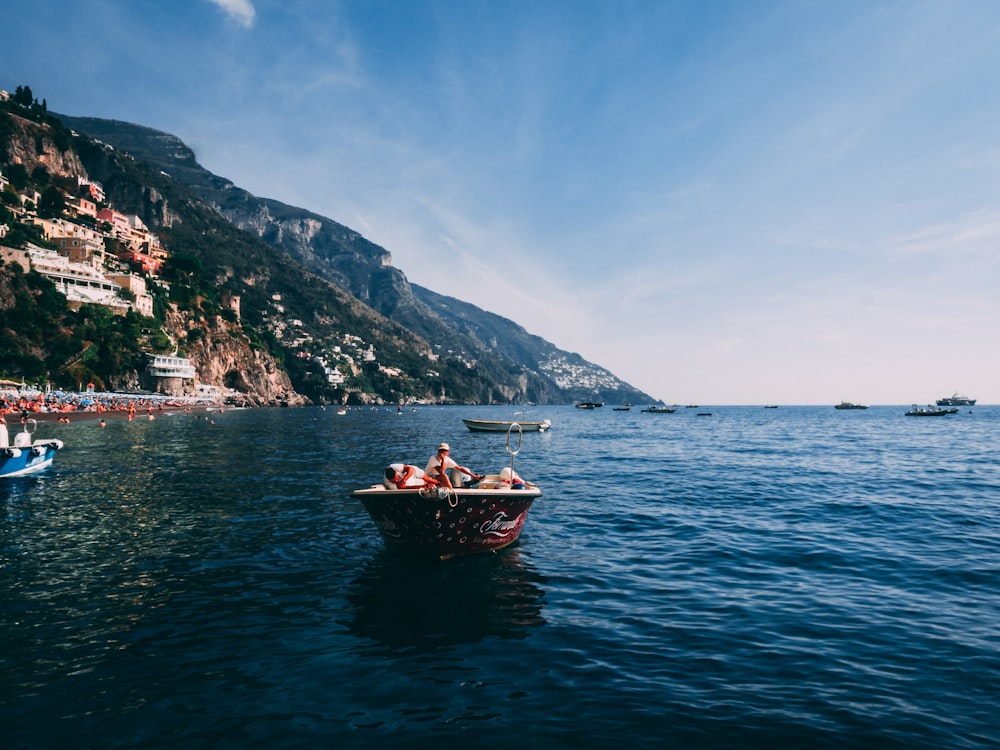 person riding on boat during daytime