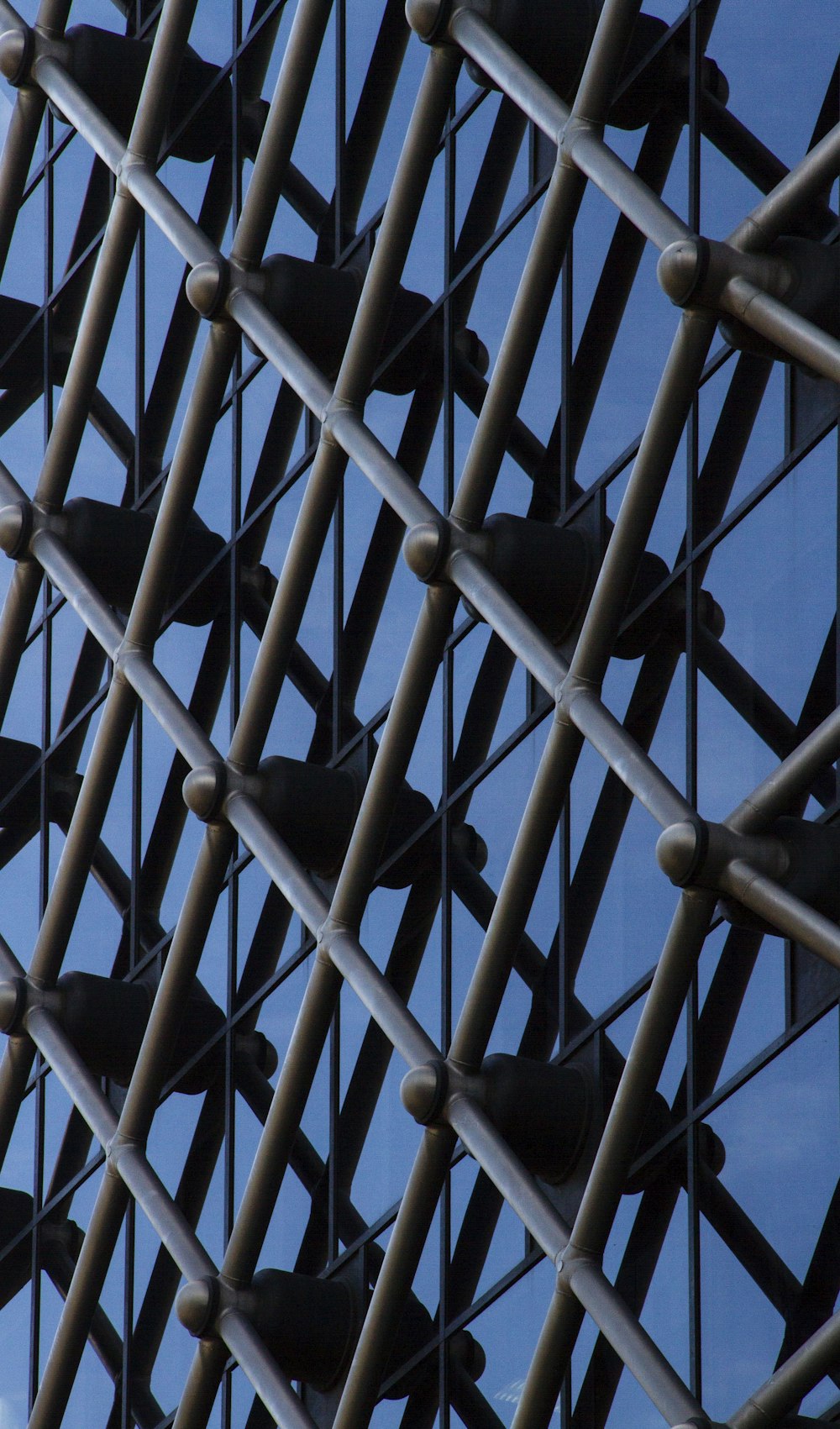 a close up of a metal structure with birds on it