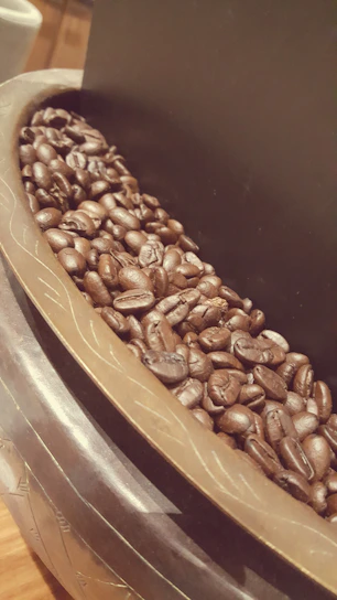 Close-up of a beautifully arranged box of assorted coffee blends with rich colors and textures.