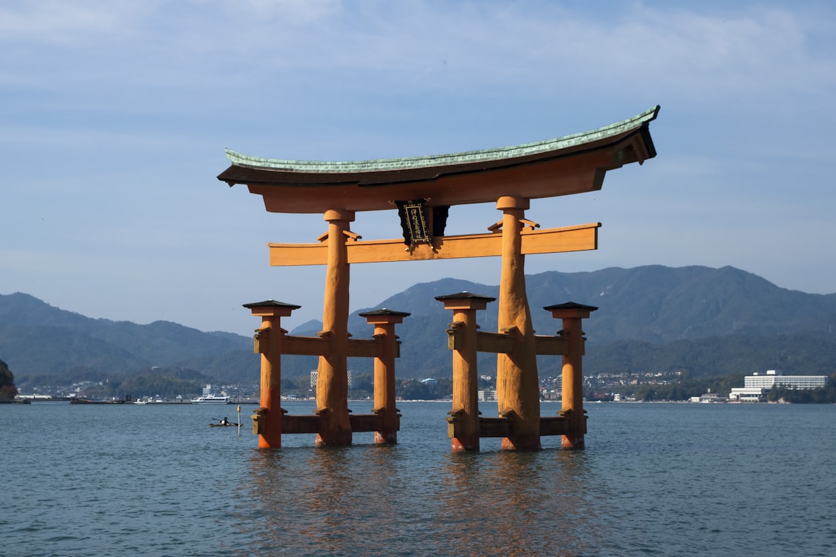 Torii gate of Itsukushima Shrine rising from the sea at Miyajima