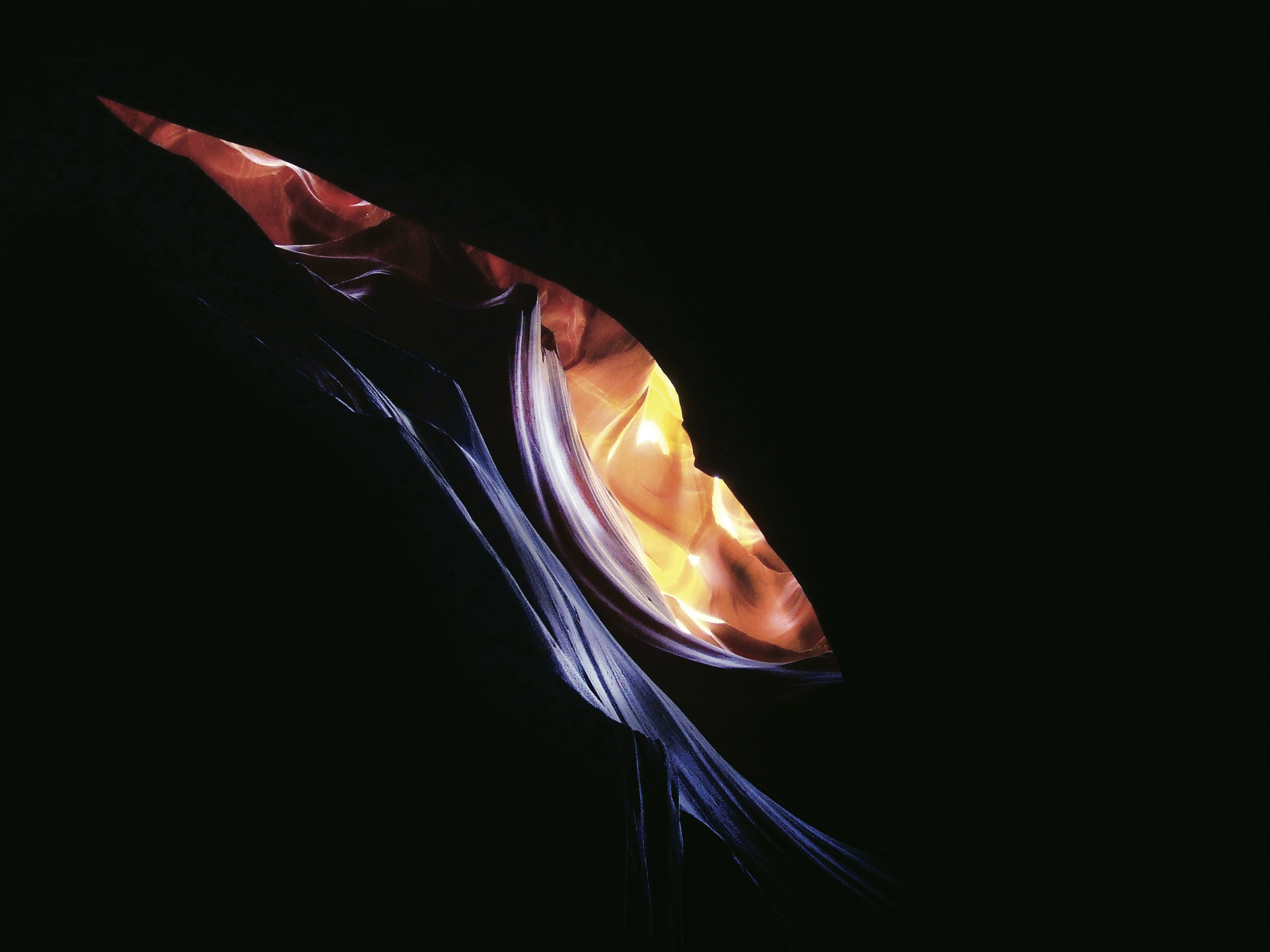 a close up of a colorful object in the dark