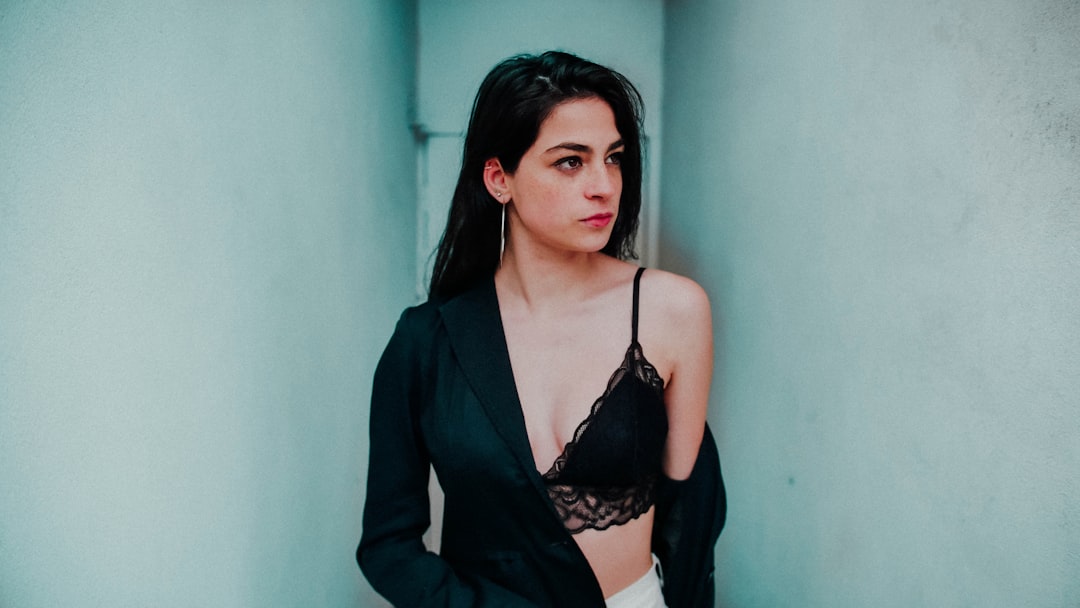 woman wearing black lace spaghetti strap top,