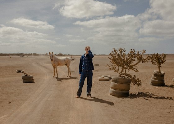 A man and a donkey on a dirt road — Sal, Cape Verde