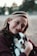 smiling woman hugging puppy
