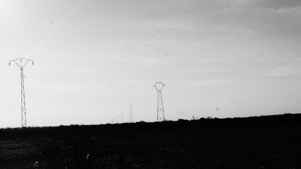 silhouette photo of transmission network