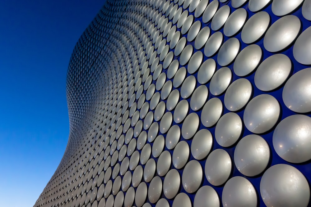 a close up of a building with a blue sky in the background