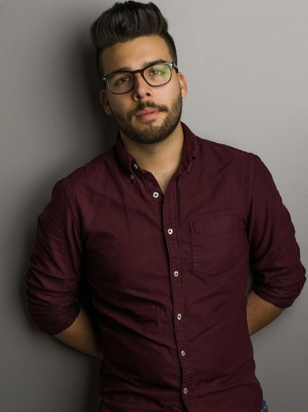 man in maroon sport shirt