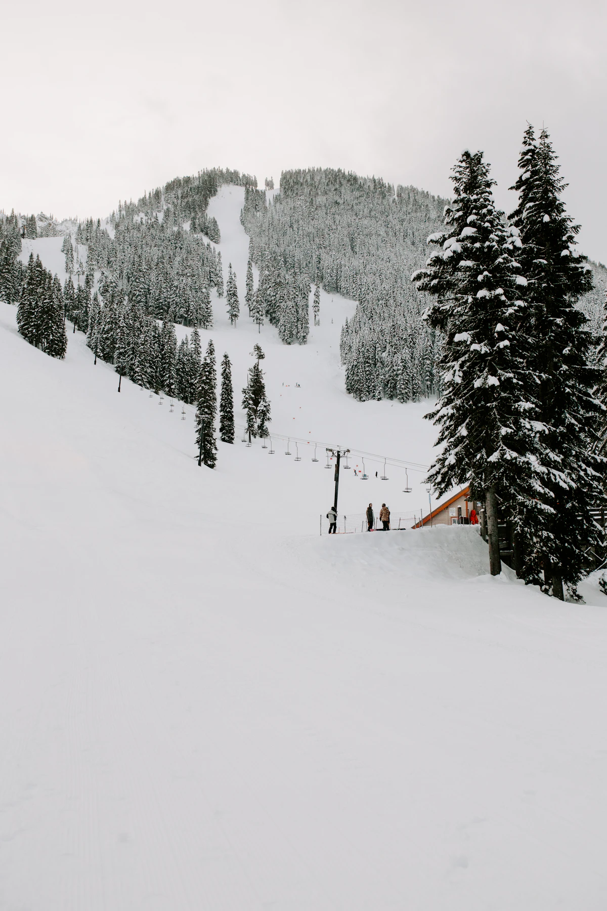 Snow-covered ski slope and mountain peaks