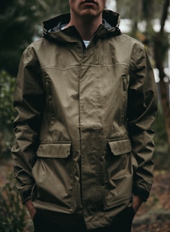 shallow focus photo of man in brown full-zip hoodie