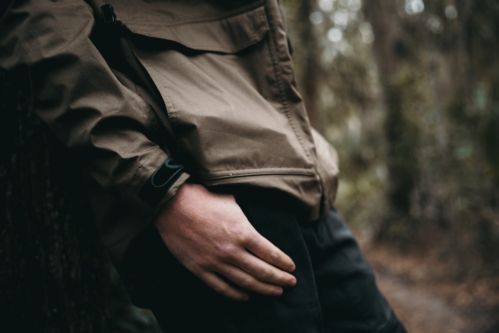 man wearing gray zip-up jacket