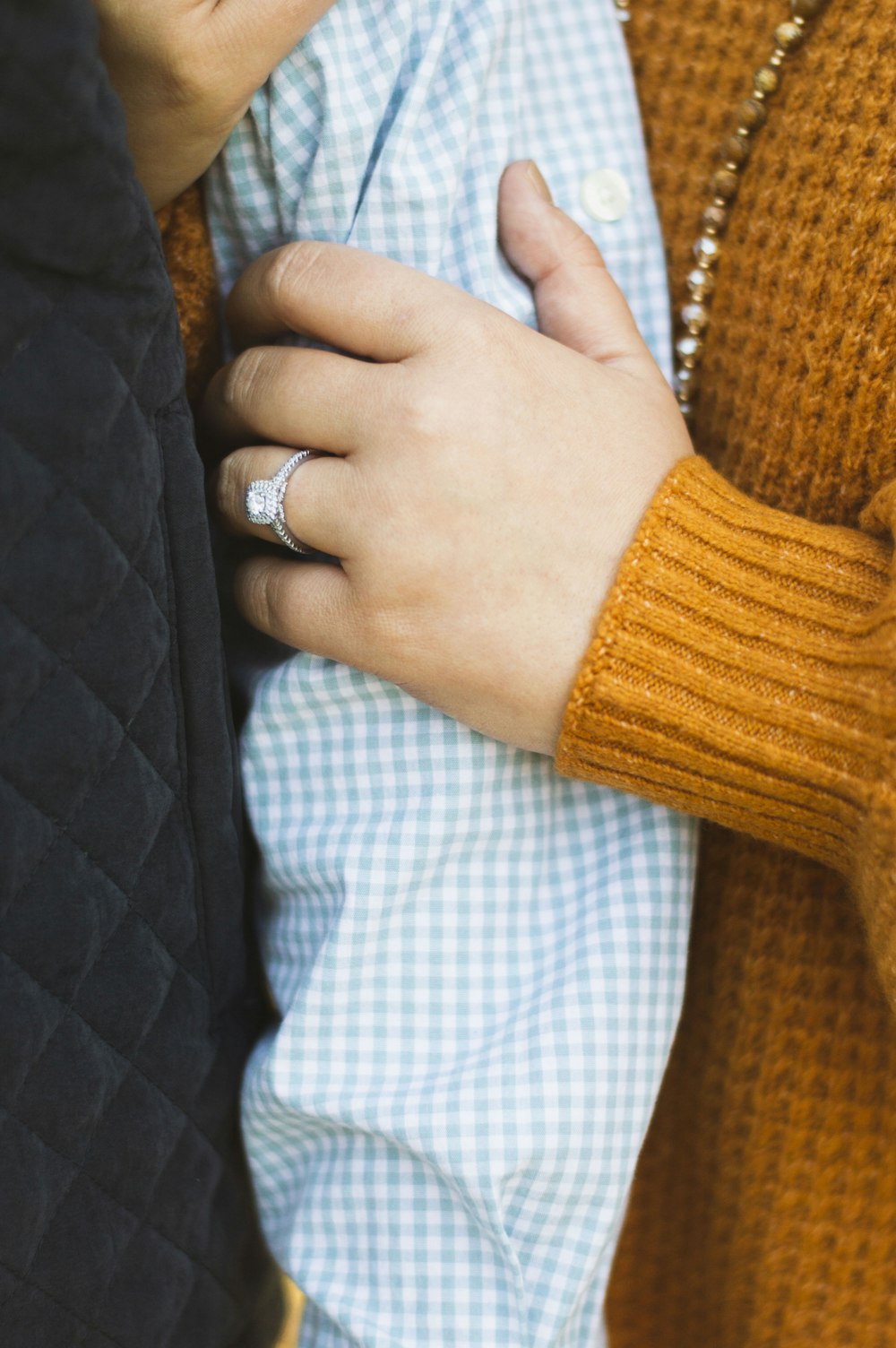 person holding another person's arm