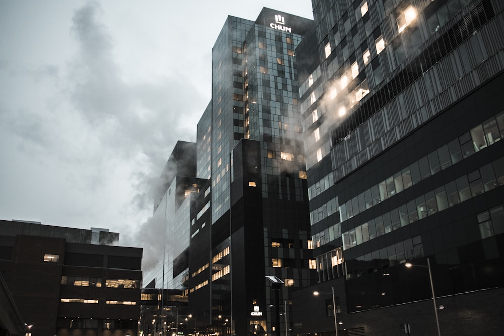 curtain wall buildings under white sky