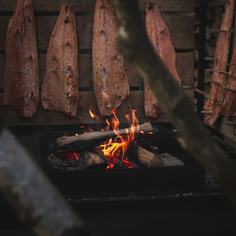 salmon fillets cooked on wood fire