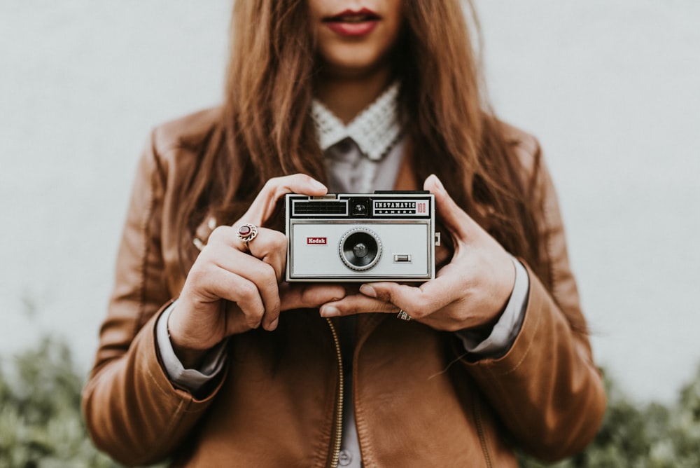 woman holding camera