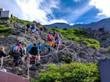 group of people on gray rock