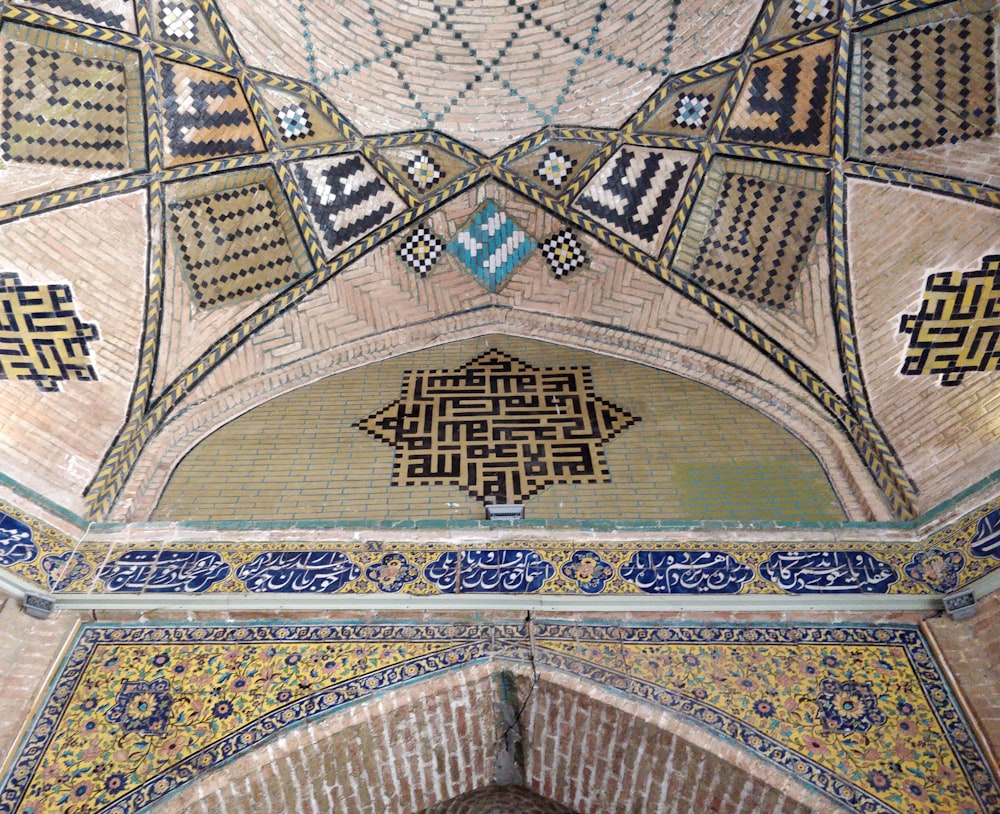 the ceiling of a building with a decorative design on it