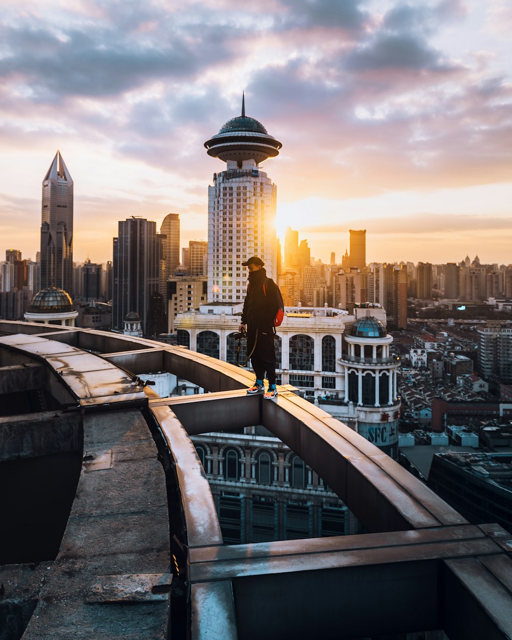 man standing on building edge