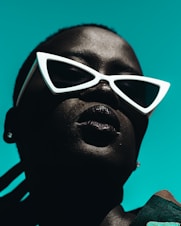 woman wearing white framed edgy sunglasses