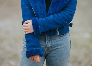 woman wearing blue coat