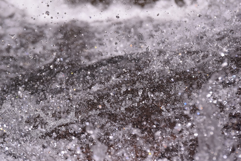 a close up of a water spewing out of the ground