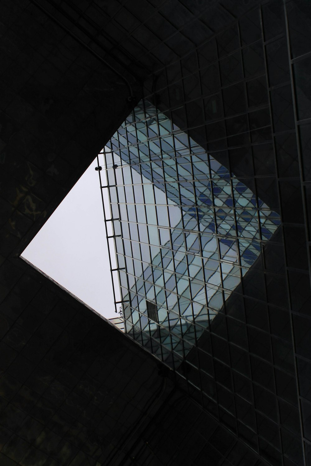 glass-wall building under white sky