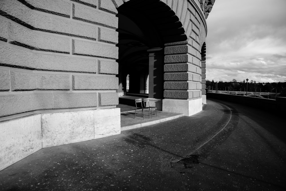 gray scale photo of tables and chair