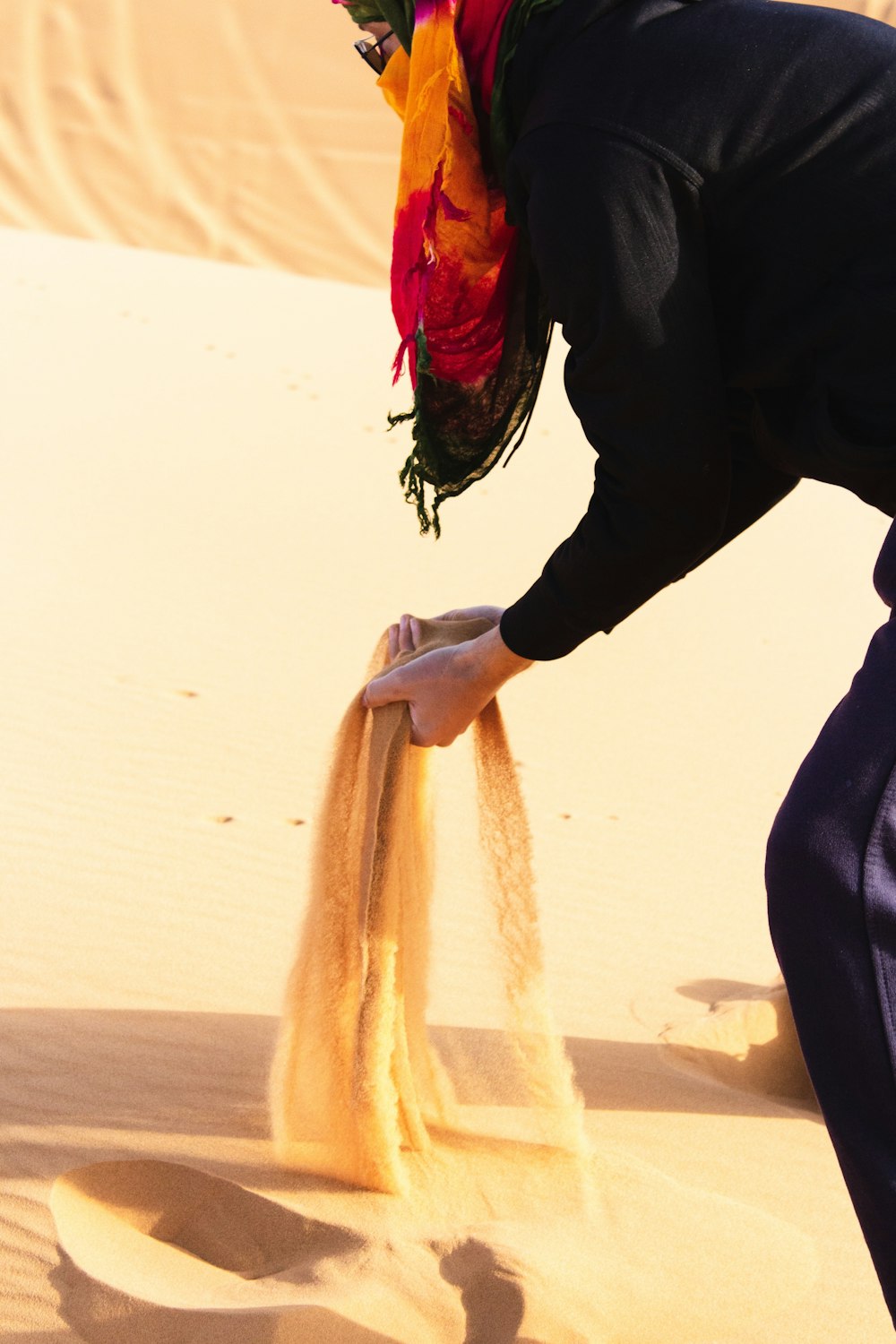 person holding sand during daytime