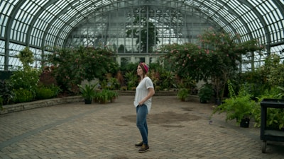 woman standing in the middle of garden