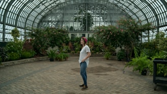 woman standing in the middle of garden