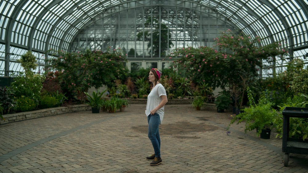 woman standing in the middle of garden