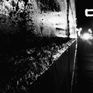 Close-up of a wall reflecting sunlight with a shiny, glossy paint finish.