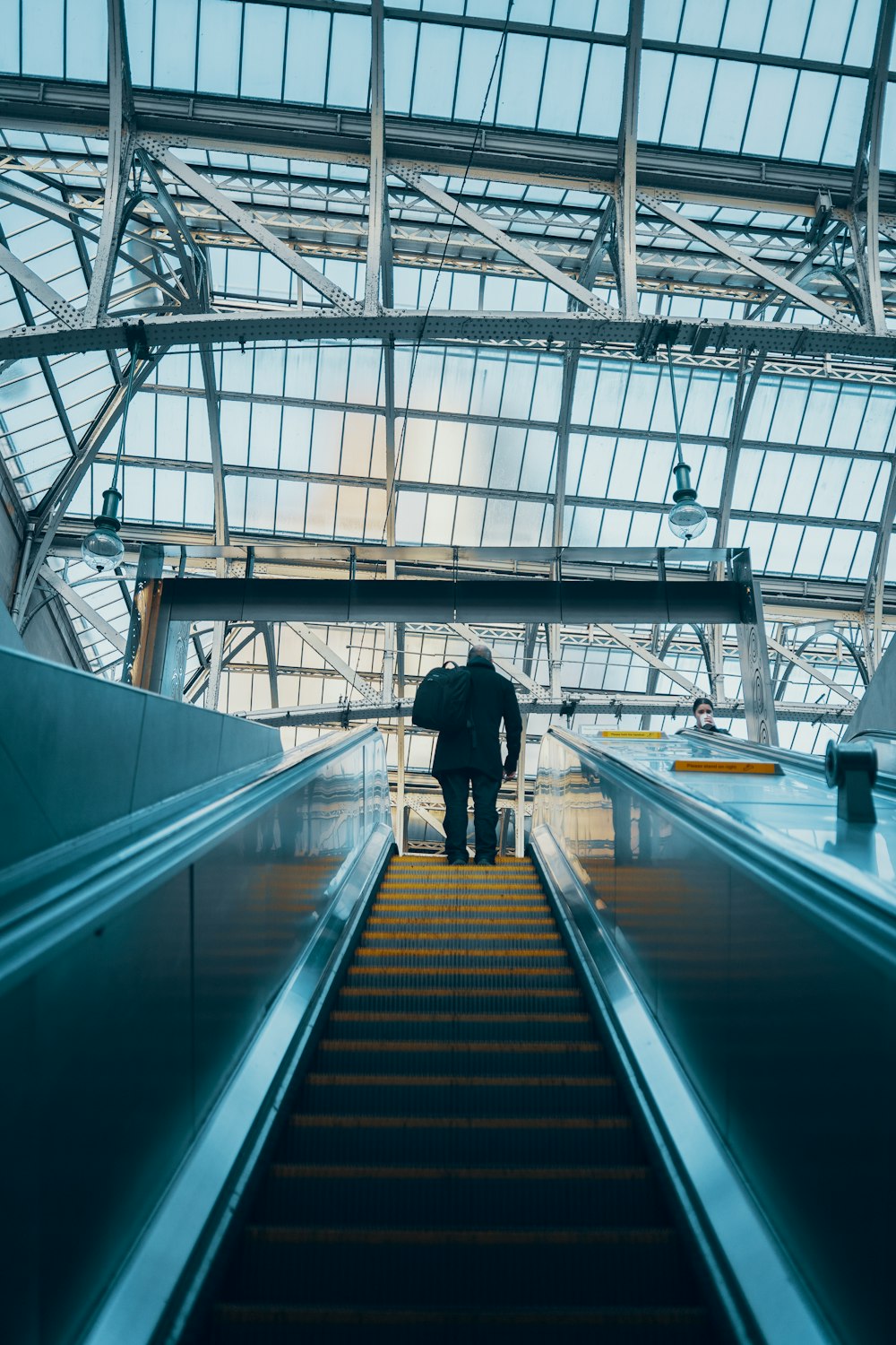 man on escalator