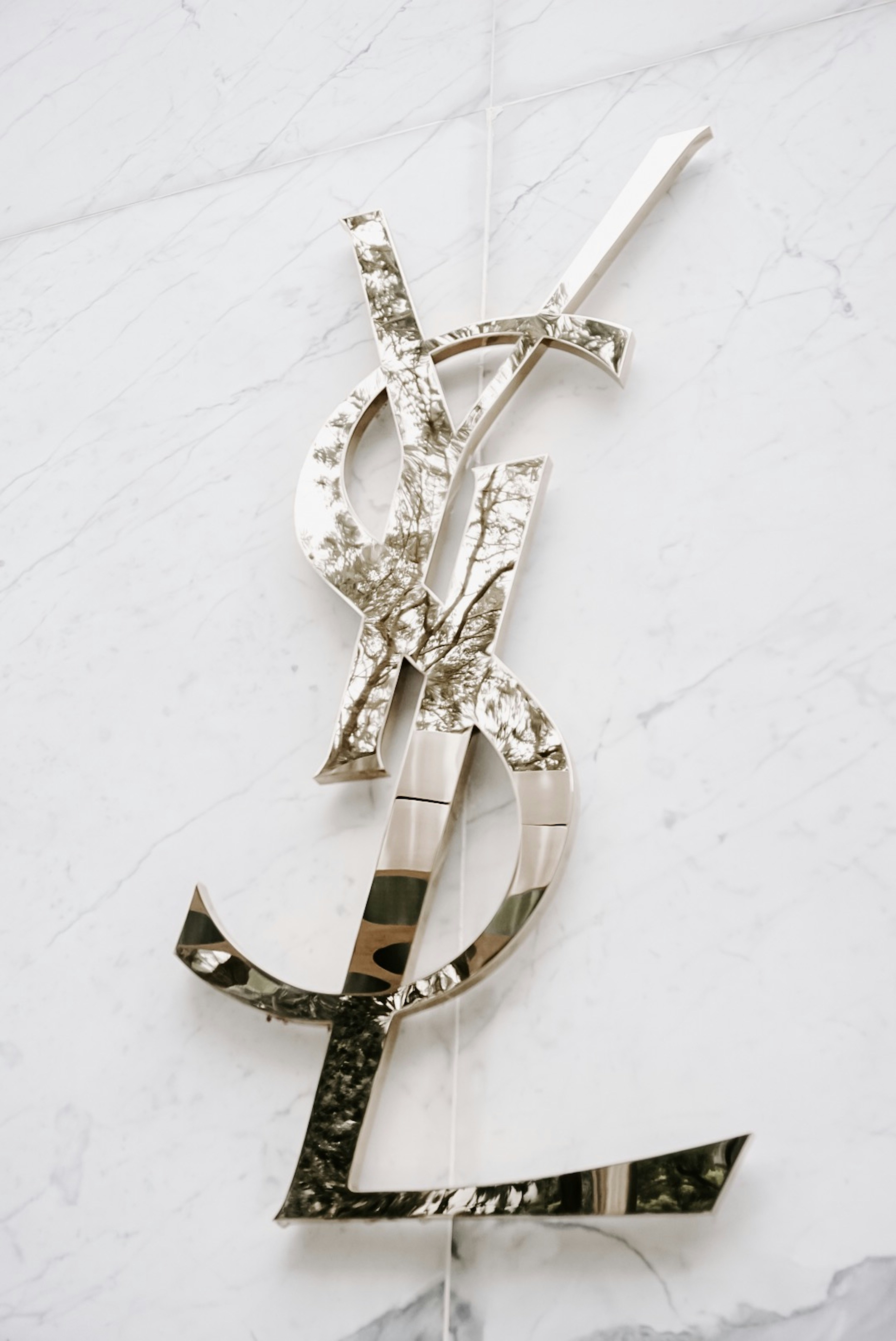 Yves Saint Lauren Emblem Photo Free Grey Image On Unsplash