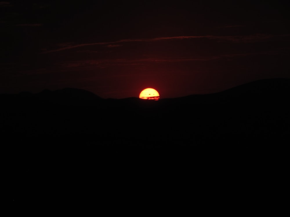 silhouette of mountain during sunset